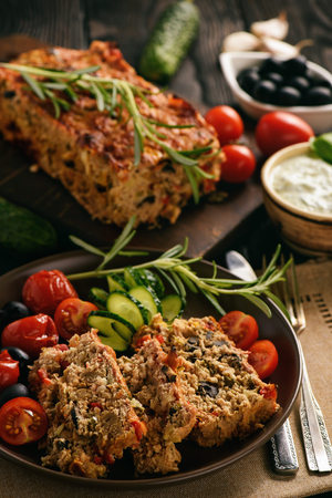 Meatloaf, greek style kitchen, on black background.の写真素材