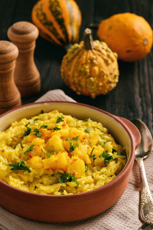 Risotto with pumpkin, cheese and parsley.の写真素材