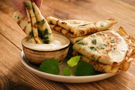Savory pancakes (crepes) with parsley.の写真素材