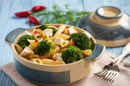 Pasta penne with broccoli, feta cheese and pepper.の写真素材