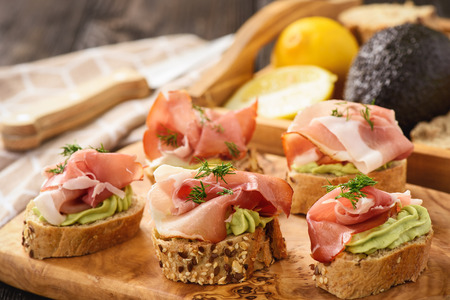 Canape with procciutto and guacamole, italian style cuisine.の写真素材