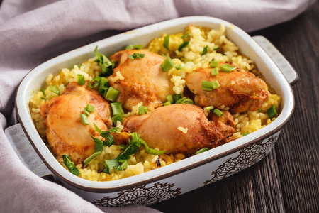 Oven baked chicken meat with rice.の写真素材