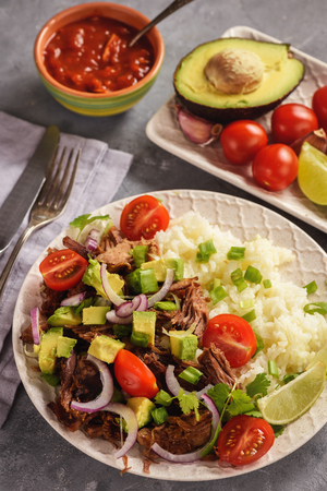 Pulled lamb with boiled rice and vegetables.の写真素材