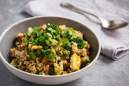 Thai pork rice with fried eggs and cilantro.の写真素材