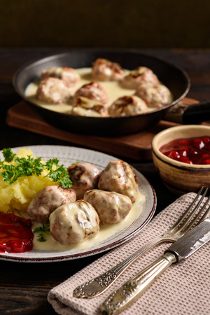 Swedish meatballs with creamy gravy, mashed potatoes and lingonberry sauce.の写真素材