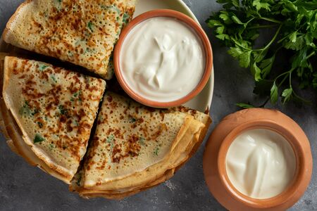 Savory pancakes (crepes) with parsley.