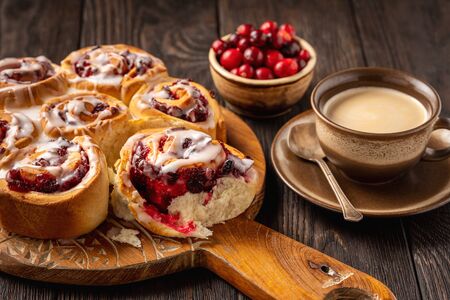 Homemade cranberry and orange swirl buns wuth glaze.の写真素材