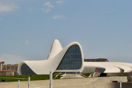 Baku Azerbaijan. Circa July 2017: The entrance of Heydar Aliyev Center, designed by Zaha Hadid with neighborhood buildings as background.のeditorial素材
