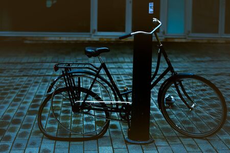 Broken bicycle locked on A the streetのeditorial素材