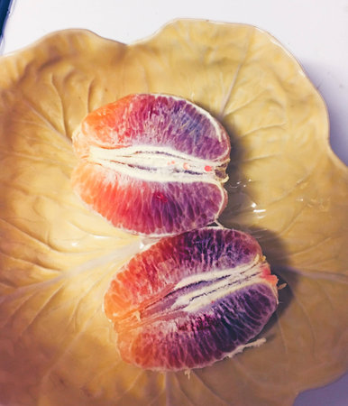 blood orange in halfの写真素材