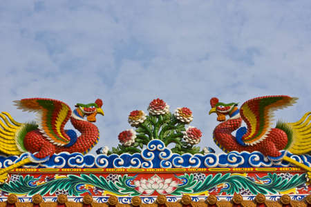 Chinese style phoenix on the roofの写真素材