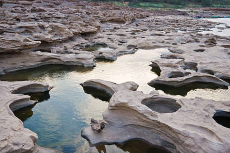 hold on stone at be side of mekong river Thailandの写真素材