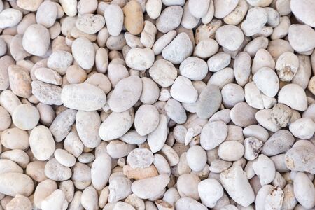 Stone pebbles texture or stone pebbles background for interior design business. exterior decoration and industrial construction idea concept design. stone pebbles motifs that occurs natural.の写真素材