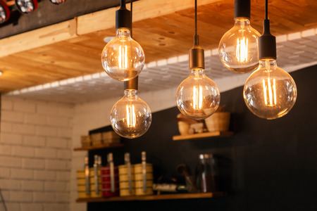 Decorative antique LED tungsten light bulbs hanging on ceiling.の写真素材
