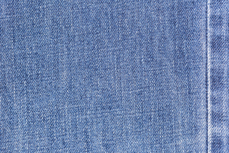 Denim jeans fabric texture background with seam for clothing, fashion design and industrial construction concept.の写真素材