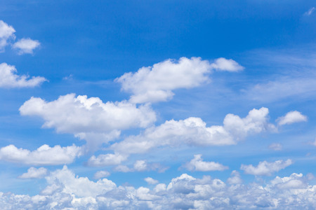 Blue sky with white clouds, rain clouds on sunny summer or spring day for background design.の写真素材