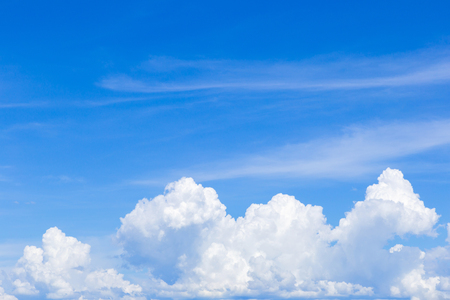 Blue sky with white clouds, rain clouds on sunny summer or spring day for background design.の写真素材