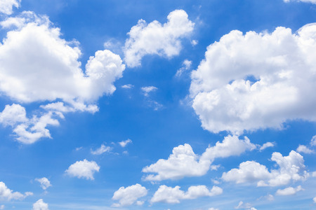 Blue sky with white clouds, rain clouds on sunny summer or spring day for background design.の写真素材