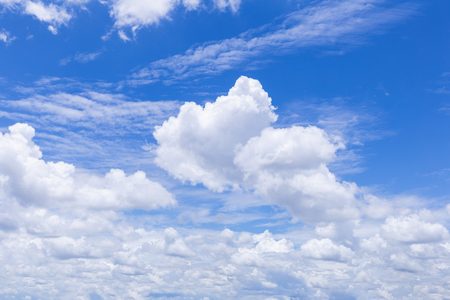 Blue sky background with white clouds, rain clouds on sunny summer or spring day.の写真素材