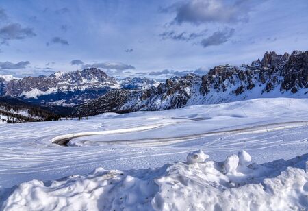 In winter the road that leads to Passo Giau opens between walls of snow