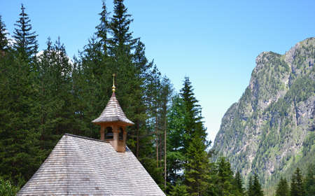 Foreground on the roof of the small chapel in the woodsの写真素材