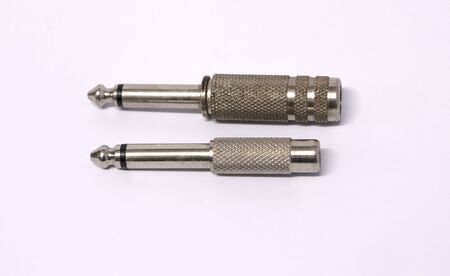 Two of old used audio jack plug connector isolated on white backgroundの写真素材