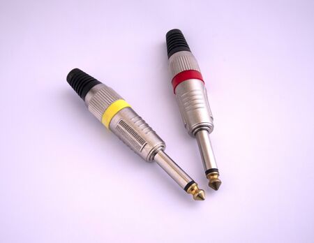 Two colors of audio plug and microphone connector isolated on white backgroundの写真素材