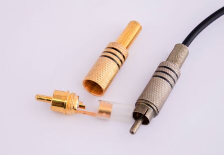 Open RCA connectors with gold covering for audio and video and used RCA with wire. Isolated on white background.の写真素材