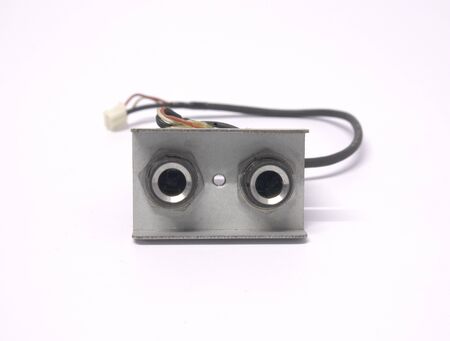 two of jack audio connector output sockets isolated on white backgroundの写真素材