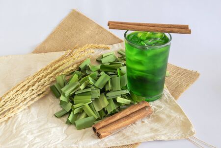 Cut pandan leaves and pandan cool drink,  pandan leaf used to enhance the flavouring and colour in Asia food.の写真素材