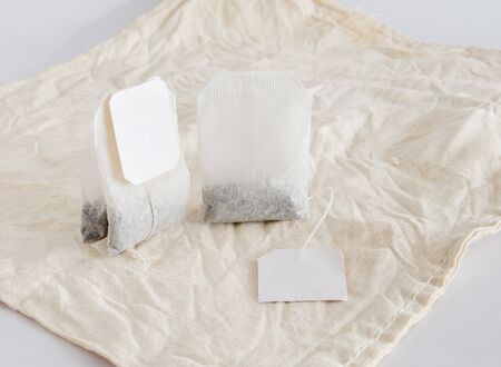 Tea bags are small bag of dried tea leaves that is soaked in hot water to make tea.の写真素材
