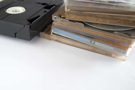 Pile of VHS analog video recording, isolated on white background.