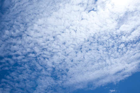Bright blue sky with white fluffy clouds. on an atmosphere sunny.の写真素材