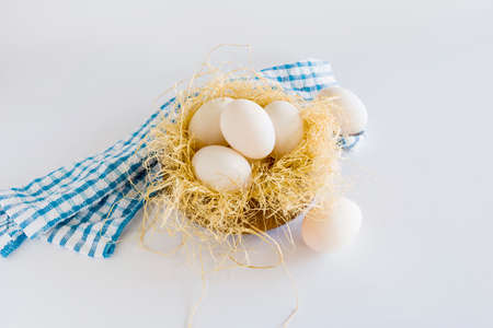Many duck eggs lay on a straw. on white background.の写真素材