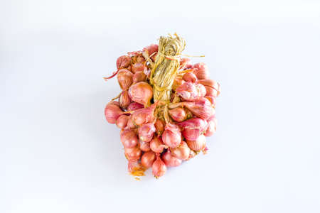Asian shallot is a type of onion, it is a small bulb size, isolated on white backgroundの写真素材