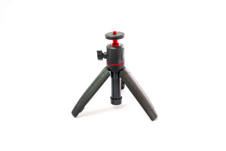 Small black tripod with red ball head for smartphone camera isolated on white backgroundの写真素材