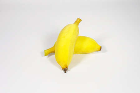 Two of banana yellow fruit isolated on white backgroundの写真素材