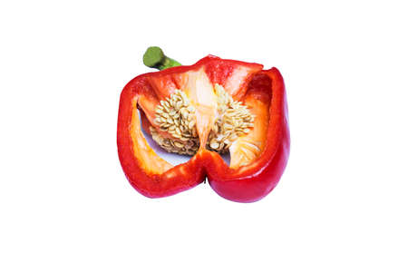 Fresh cut red bell pepper with stem removed. selective on seeds. isolated on a white background with...