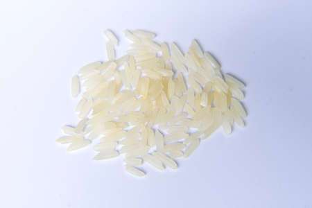 Top view. jasmine rice grains isolated on white background. Flat layの写真素材