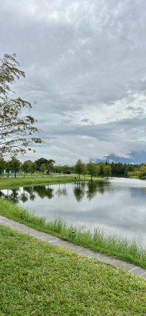 Lake in the park with cloudy blue sky background,Thailand.の写真素材