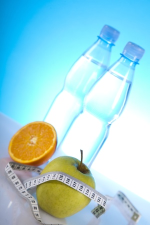 fruits and bottles of mineral waterの写真素材