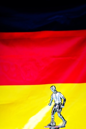 german flag and figure of football playerの写真素材