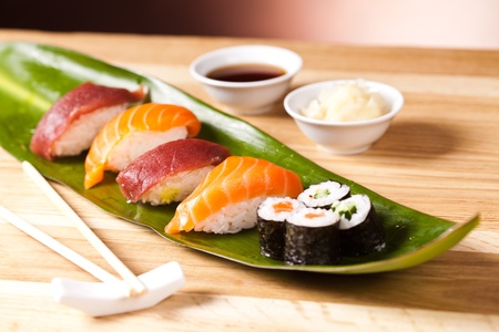 Sushi rolls closeup with fresh salmon on leafの写真素材