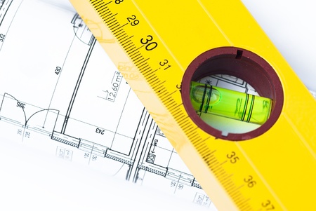 spirit level and architectural drawings