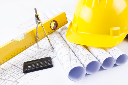 hard hat and construction tools and blueprintsの写真素材