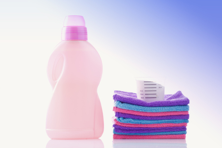 laundry powder and softener with fresh towelsの写真素材