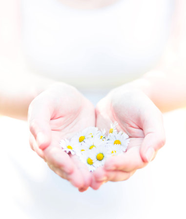 flowers in hands, purity concept