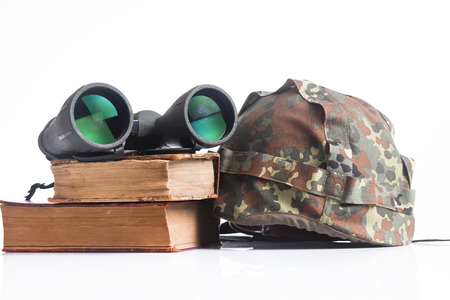 Military helmet and binoculars on a white backgroundの写真素材