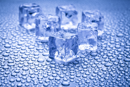 Wet ice cubes and water drops