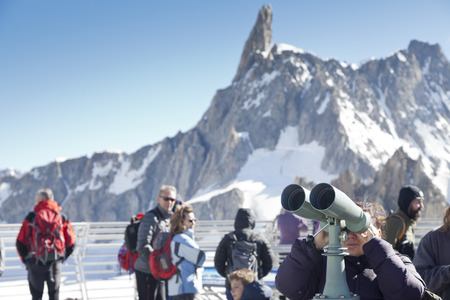 COURMAYEUR, IT - JULY 29, 2016: Unidentified people take a picture a panoramic terrace of Punta Helbronner new SKYWAY MONTE BIANCO terminal in Aosta Valley region of Italy.のeditorial素材
